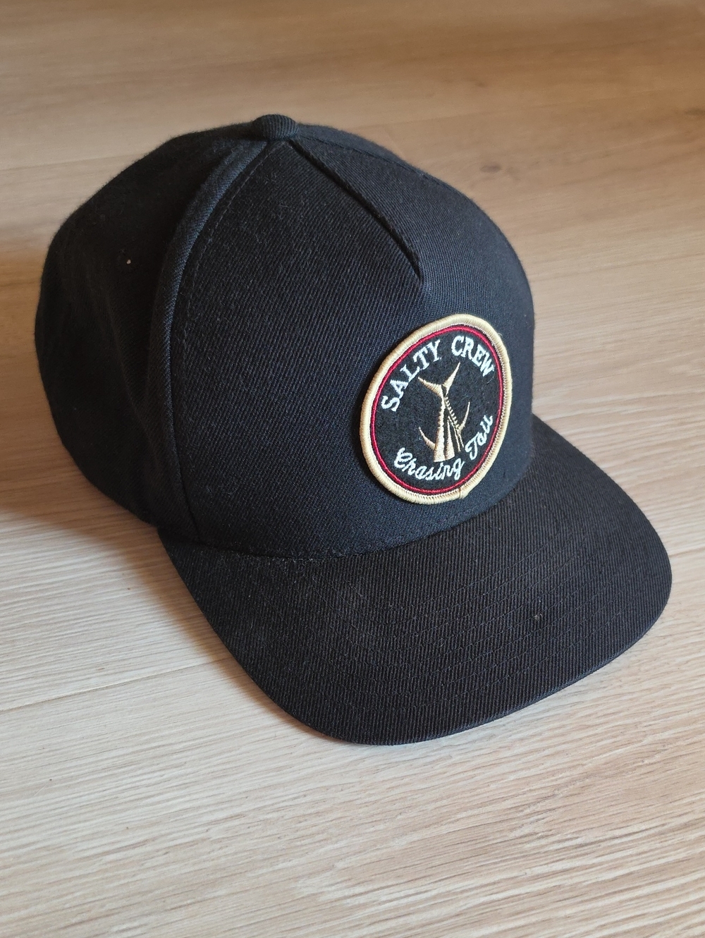 Salty Crew Black Cap with Gold & Red Patch
